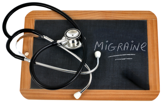 Migraine word written on board with stethoscope on top